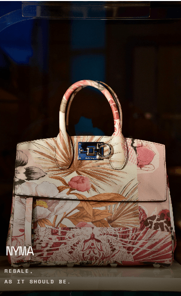 The welcome photograph as shipped: a floral Studio bag in a dark vitrine, the NYMA wordmark and resale tagline set on the image.